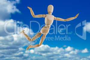 Composite image of 3d illustration of carefree wooden figurine jumping in air