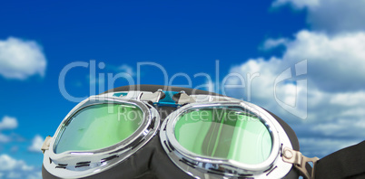 Composite image of aviator goggles on white background