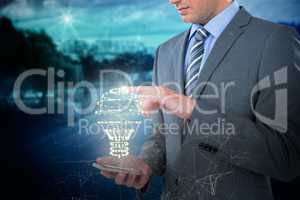 Composite image of businessman using mobile phone