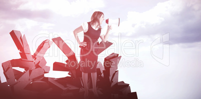 Composite image of businesswoman shouting through megaphone