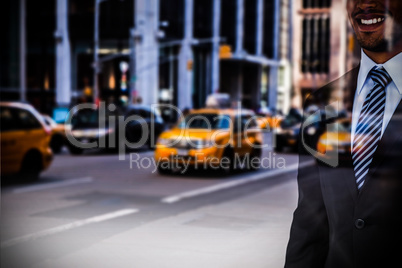Composite image of mid section of smiling businessman standing