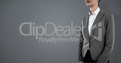 Composite image of businesswoman standing against white background