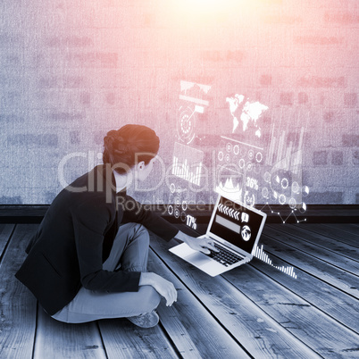 Composite image of businesswoman using laptop on white background