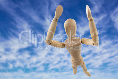 Composite image of 3d image of carefree wooden figurine with arms raised standing
