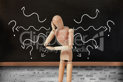 Composite image of 3d thoughtful wooden figurine pretending to lean