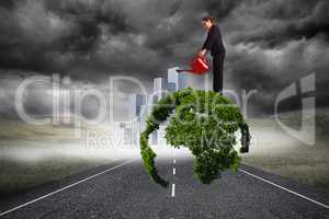 Composite image of businesswoman using red watering can