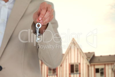 Composite image of mid section of executive showing new house key