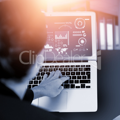 Composite image of businesswoman using laptop on white background