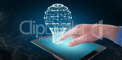 Composite image of croped hands of businessman using digital tablet