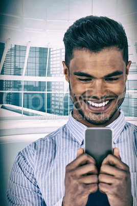 Composite image of happy businessman using mobile phone