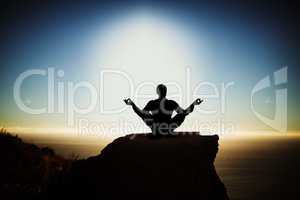 Composite image of silhouette businessman practising yoga