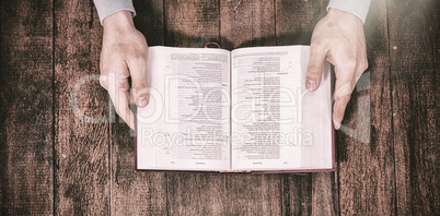 Cropped image man holding bible