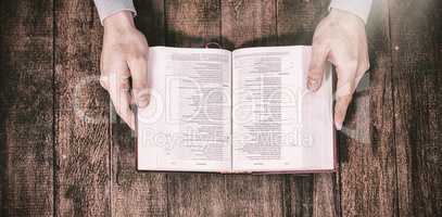 Cropped image man holding bible