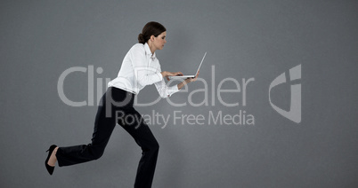 Composite image of full length of businesswoman running while using laptop