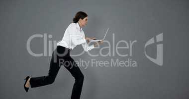 Composite image of full length of businesswoman running while using laptop