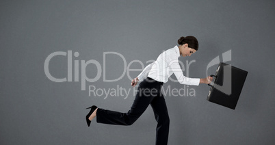 Composite image of businesswoman running with briefcase