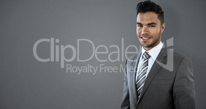 Composite image of smiling businessman standing against white background