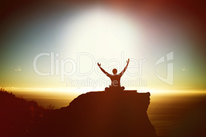 Composite image of silhouette businessman with arms raised