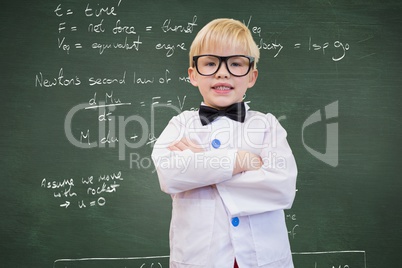 Child dressed like a professor in front of black board with school scriptures