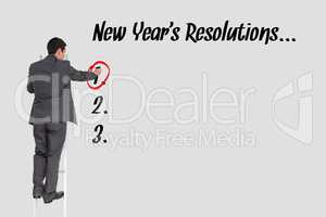 Business man is surrounding a response of new year's resolutions question against grey background