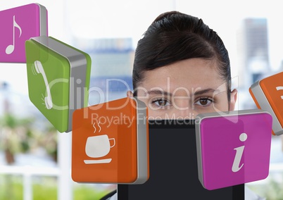 Businesswoman holding tablet with apps icons in bright office