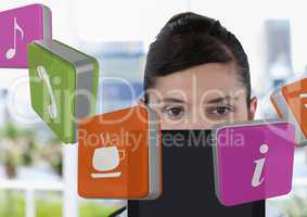 Businesswoman holding tablet with apps icons in bright office
