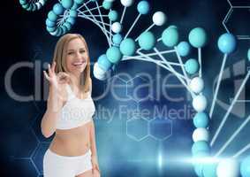 sporty woman saying OK with the hand  with dna chain and dark blue background