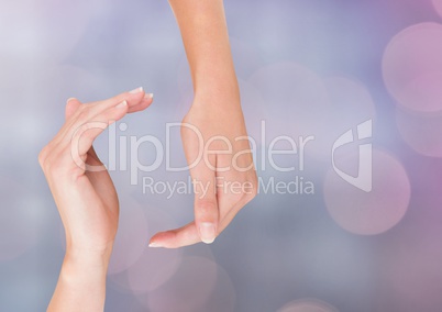 Hands in curved posture with sparkling light bokeh background Hands in curved posture with sparkling light bokeh background