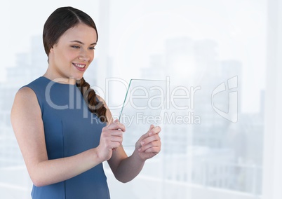 Businesswoman holding glass screen with bright background