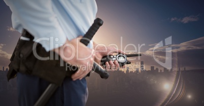 Security guard lower body against skyline and sunset