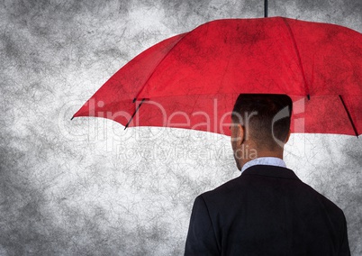 Back of business man with umbrella against white background and grunge overlay