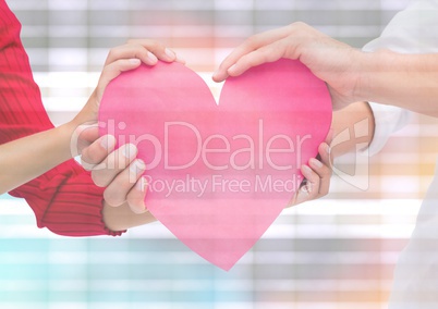 Hands holding heart with sparkling light bokeh background