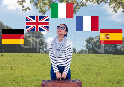 main language flags around young woman with suitcase in field