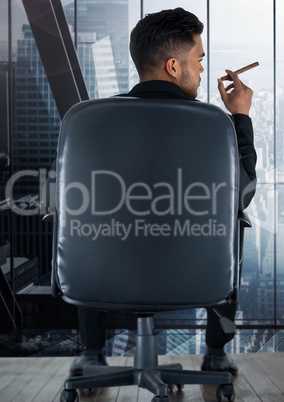 Businessman Back Sitting in Chair with  cigar and dark modern stylish windows overlooking city