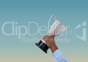 business hand with trophy.blue background