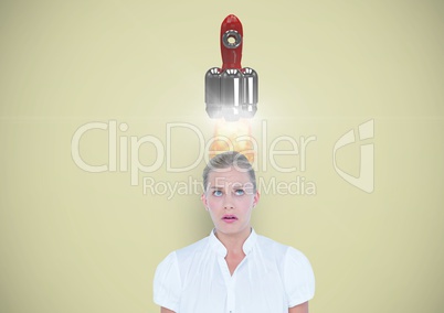 Digital composite image of rocket launch on overhead of businesswoman