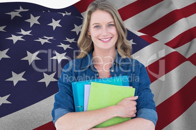 students is holding notebooks against American flag background
