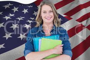 students is holding notebooks against American flag background