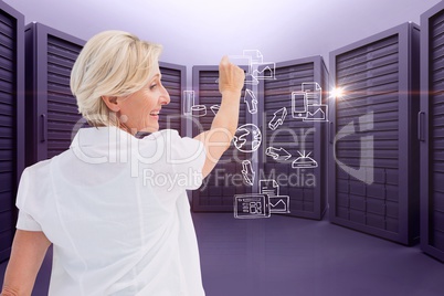 A businesswoman is drawing schema against server room background