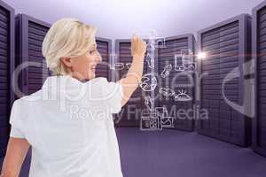 A businesswoman is drawing schema against server room background