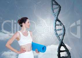 Sporty woman with realistic dna chain against a sky background