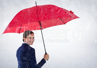 Business woman looking over shoulder with umbrella against white background and rain