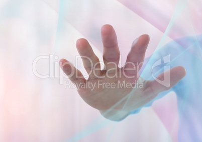 Hand reaching spread out with sparkling light bokeh background