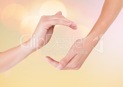 Hands in curved posture  with sparkling light bokeh background