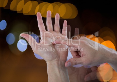 Hands counting with sparkling light bokeh background