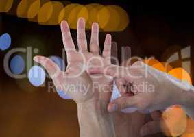 Hands counting with sparkling light bokeh background