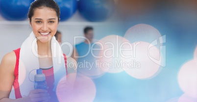 Woman with bottle and towel and blue pink bokeh transition