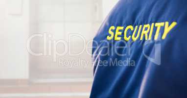Security man outside bright background lift door