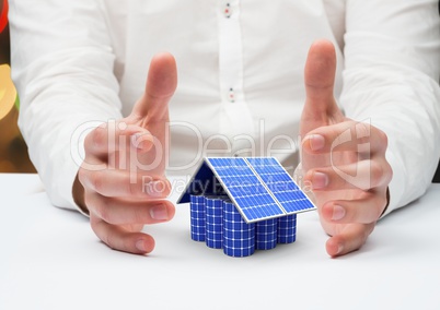 solar panel house between a hands