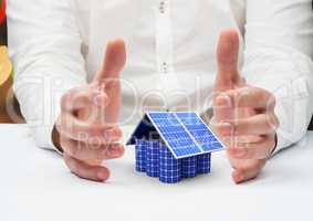 solar panel house between a hands